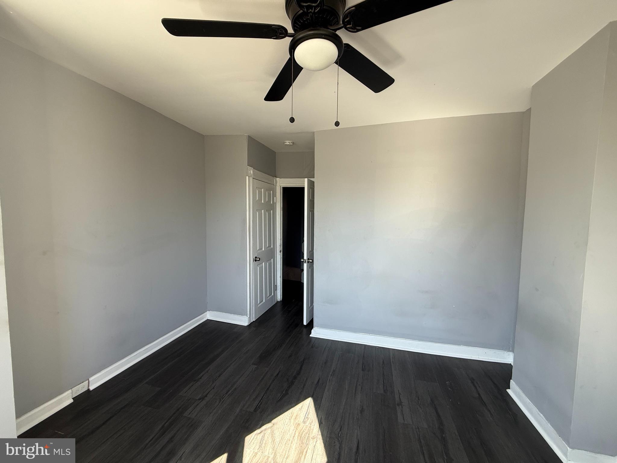 1635 Normal Avenue Baltimore, MD 21213 - Photo 14 of 18 a view of an empty room with wooden floor