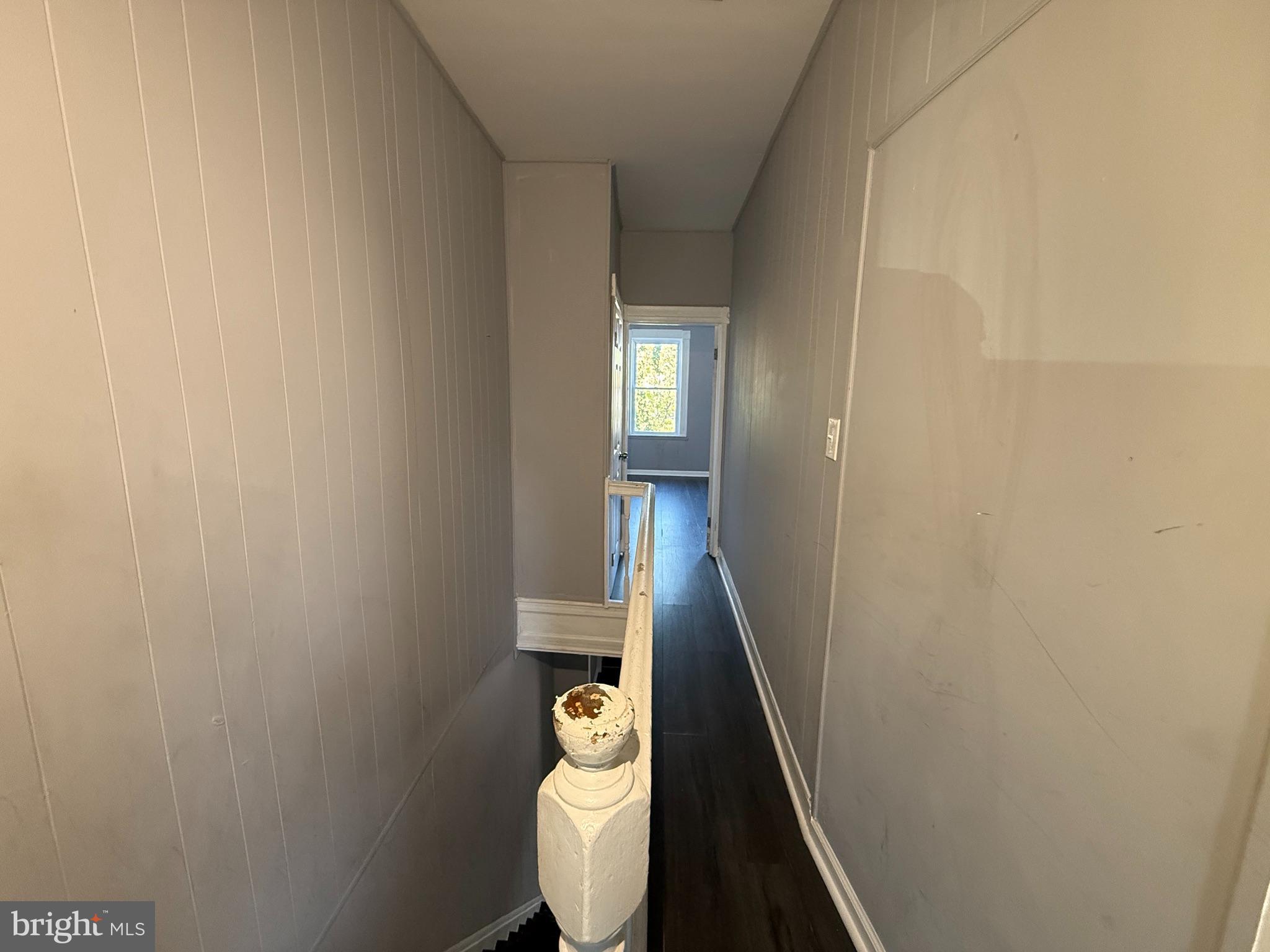 1635 Normal Avenue Baltimore, MD 21213 - Photo 8 of 18 a view of a hallway with wooden floor and staircase
