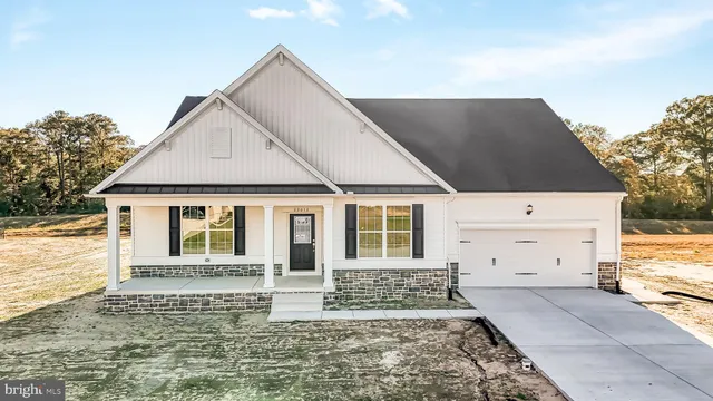 a front view of a house with a garage