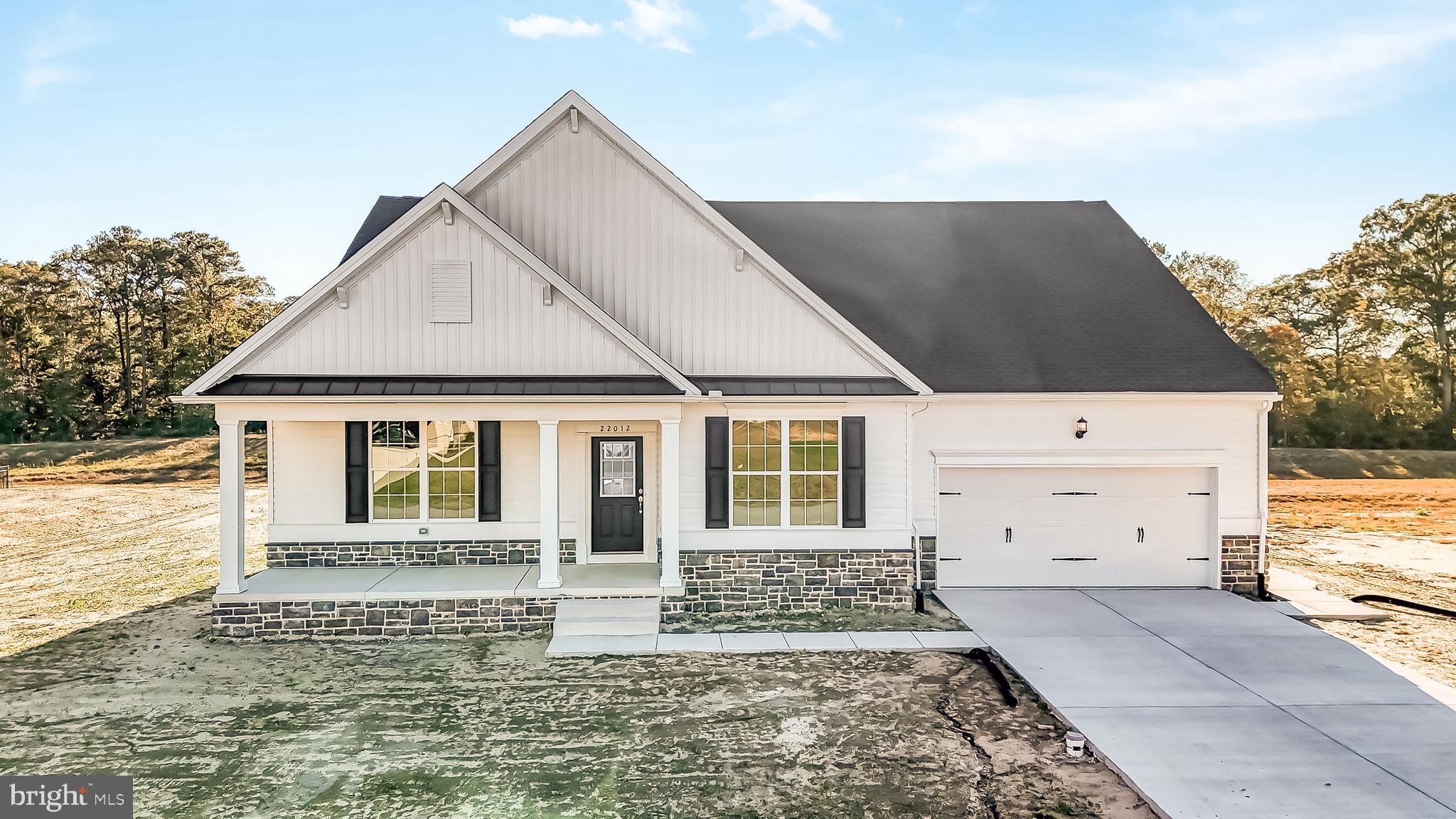 a front view of a house with a garage