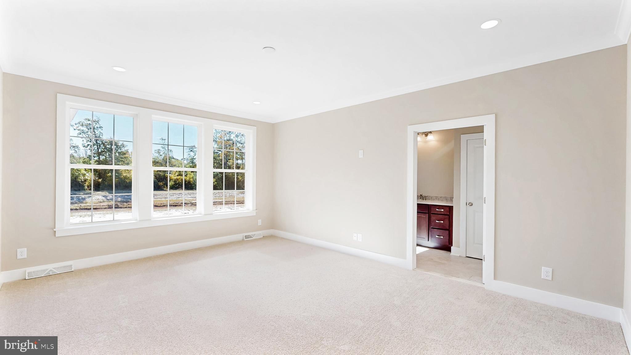 22012 Antlered Way Georgetown, DE 19947 - Photo 19 of 58 an empty room with windows and entrance