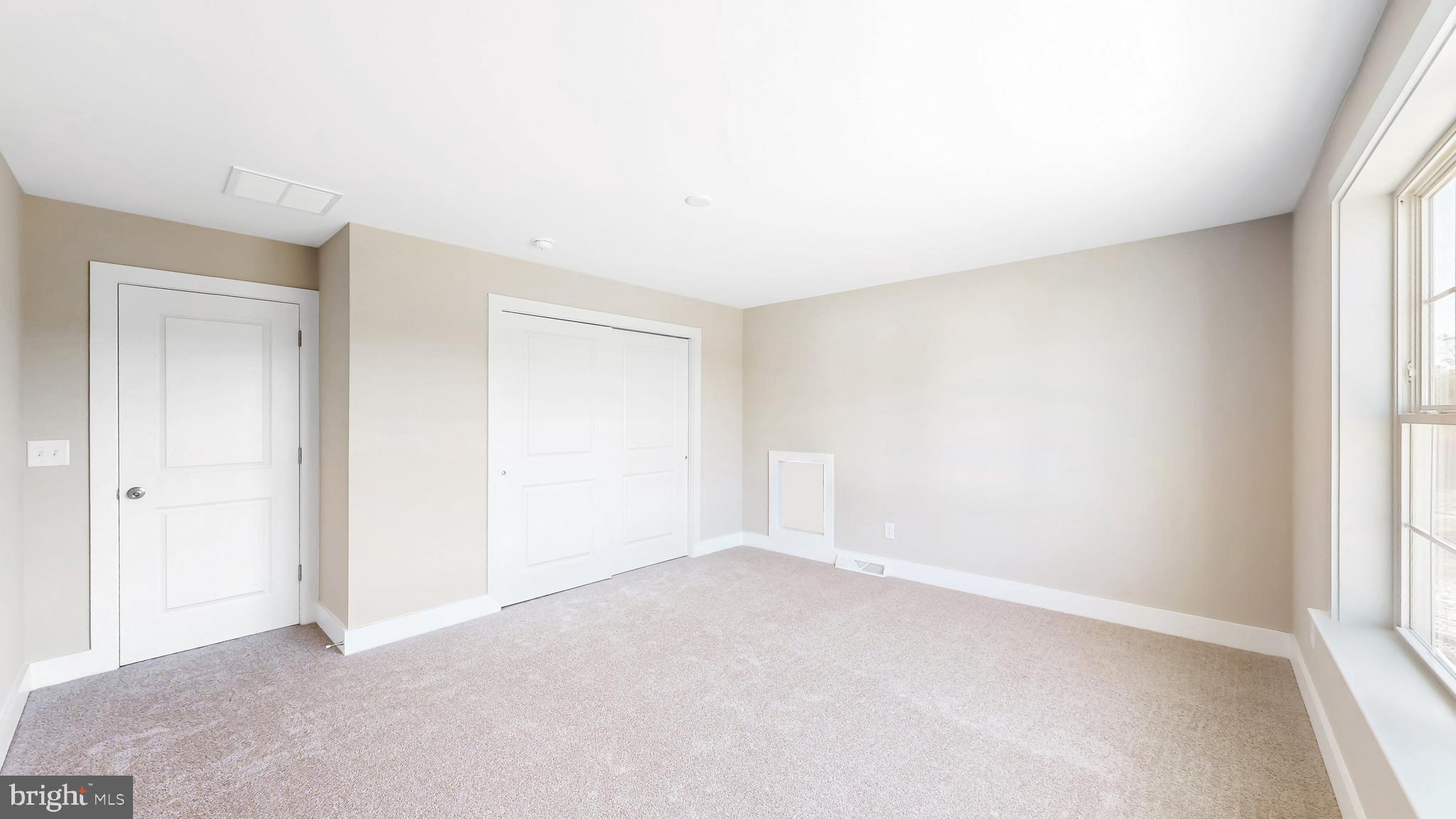 22012 Antlered Way Georgetown, DE 19947 - Photo 37 of 58 an empty room with a natural light