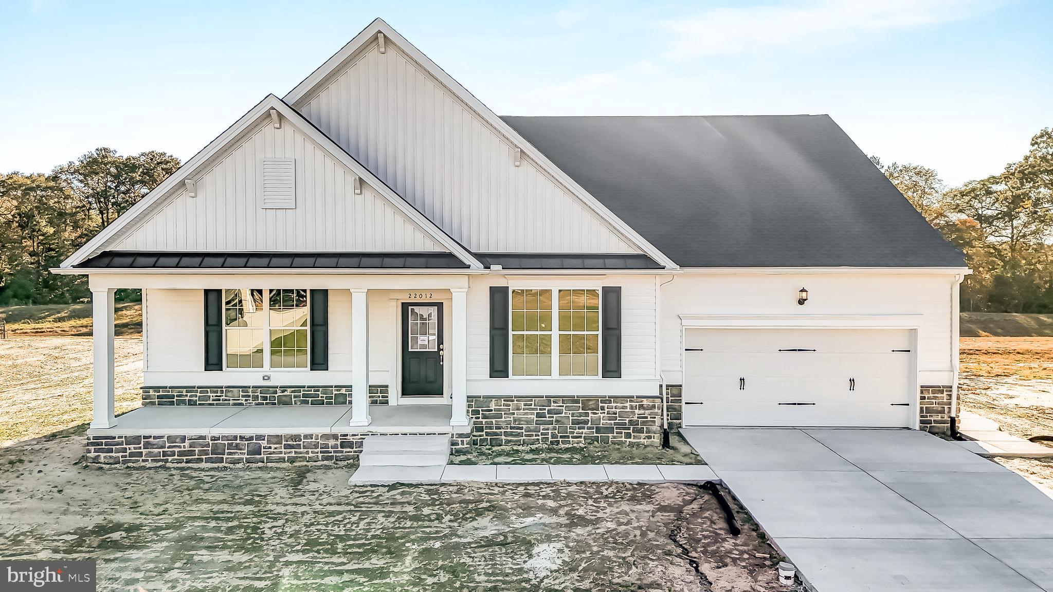 22012 Antlered Way Georgetown, DE 19947 - Photo 40 of 58 a front view of a house with a yard