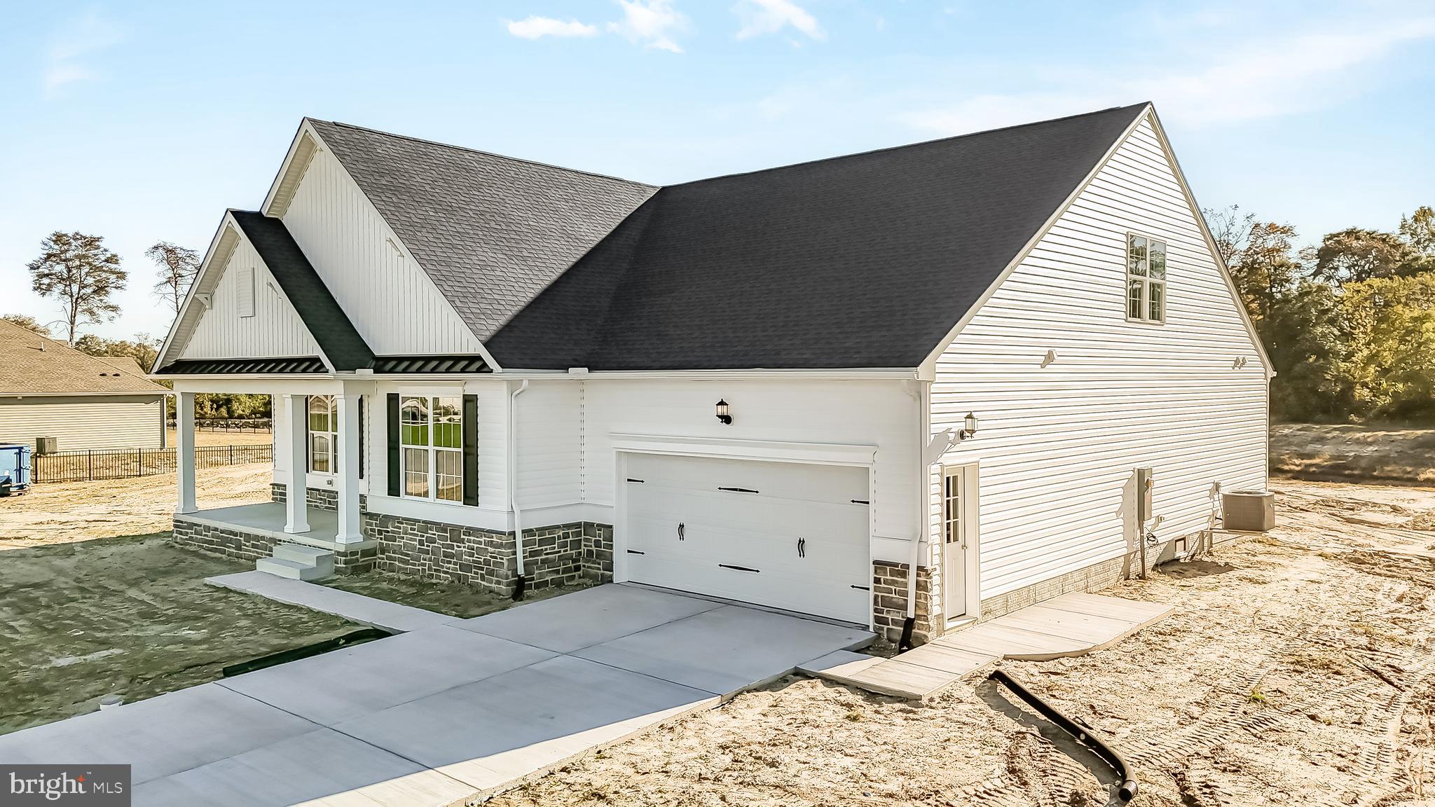 22012 Antlered Way Georgetown, DE 19947 - Photo 41 of 58 a view of a house with a barbeque