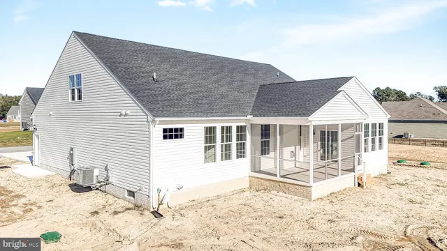 a view of house with backyard and trees