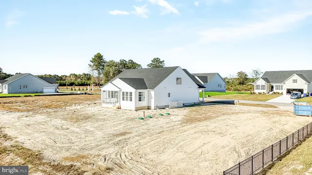 a view of a backyard with sitting area
