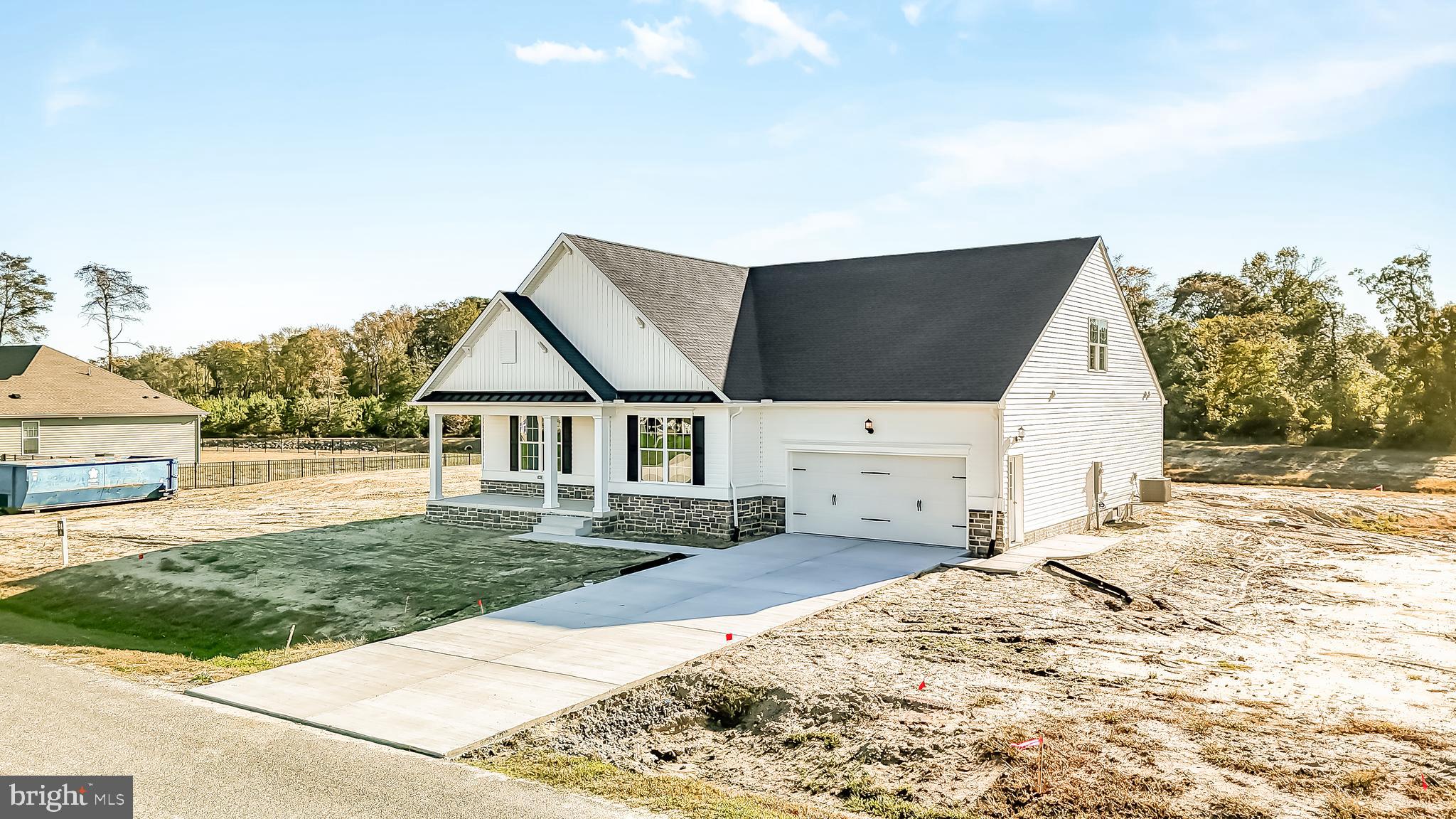 22012 Antlered Way Georgetown, DE 19947 - Photo 48 of 58 a view of house with backyard and trees