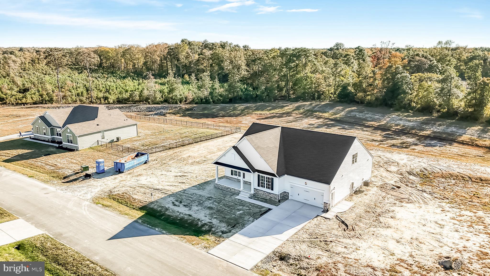 22012 Antlered Way Georgetown, DE 19947 - Photo 53 of 58 a view of a backyard with sitting area