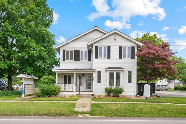 a front view of a house with a yard