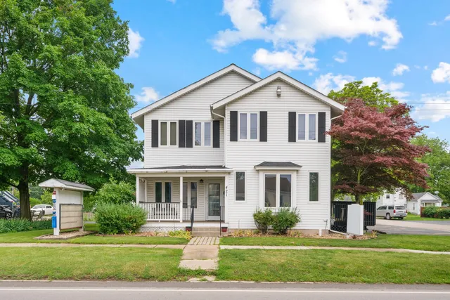 a front view of a house with a yard