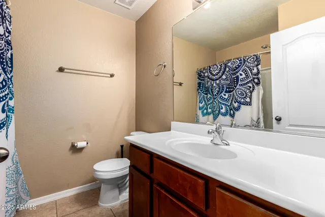 a bathroom with a sink toilet and vanity