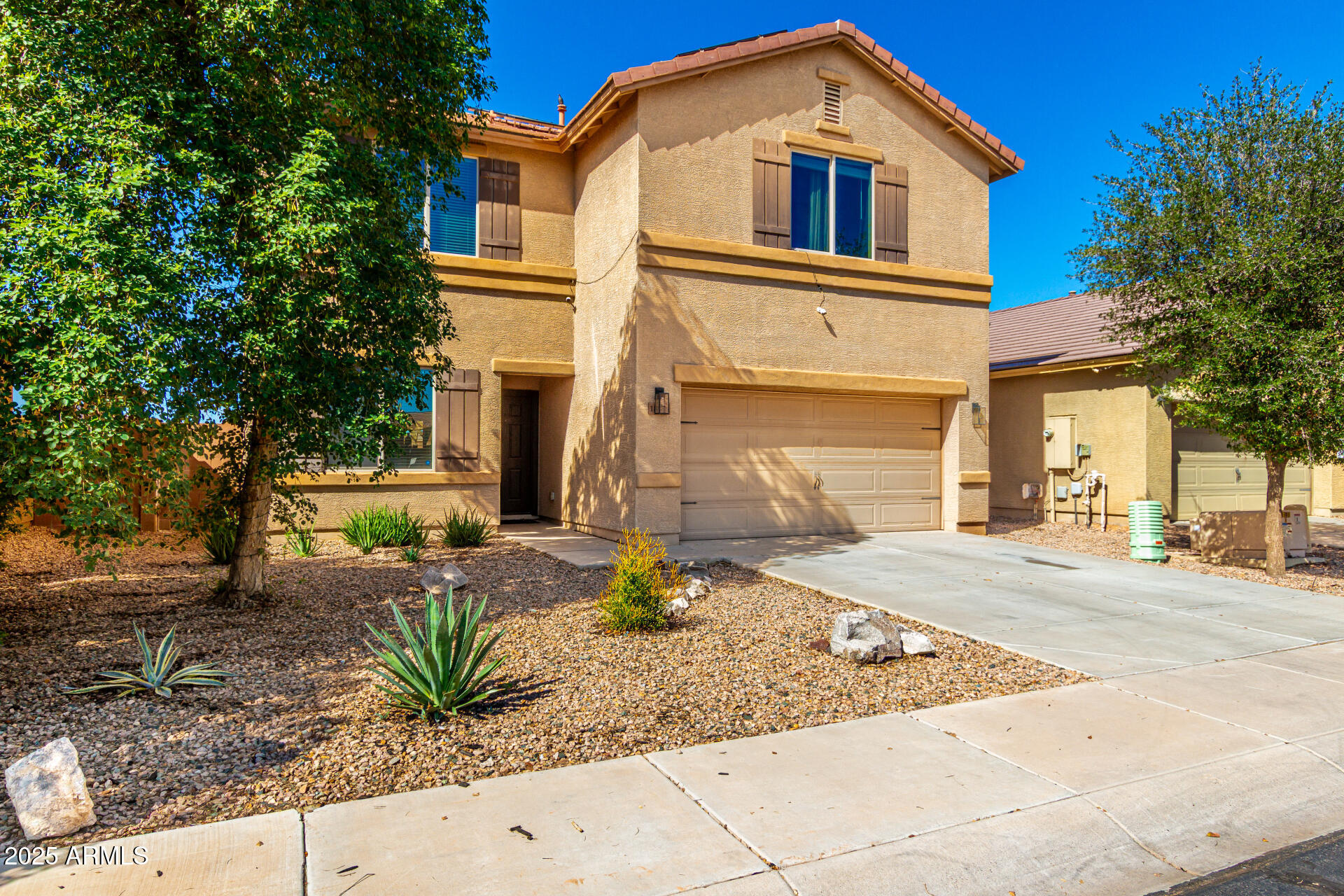 18586 North Lariat Road Maricopa, AZ 85138 - Photo 16 of 16 a front view of a house with a yard