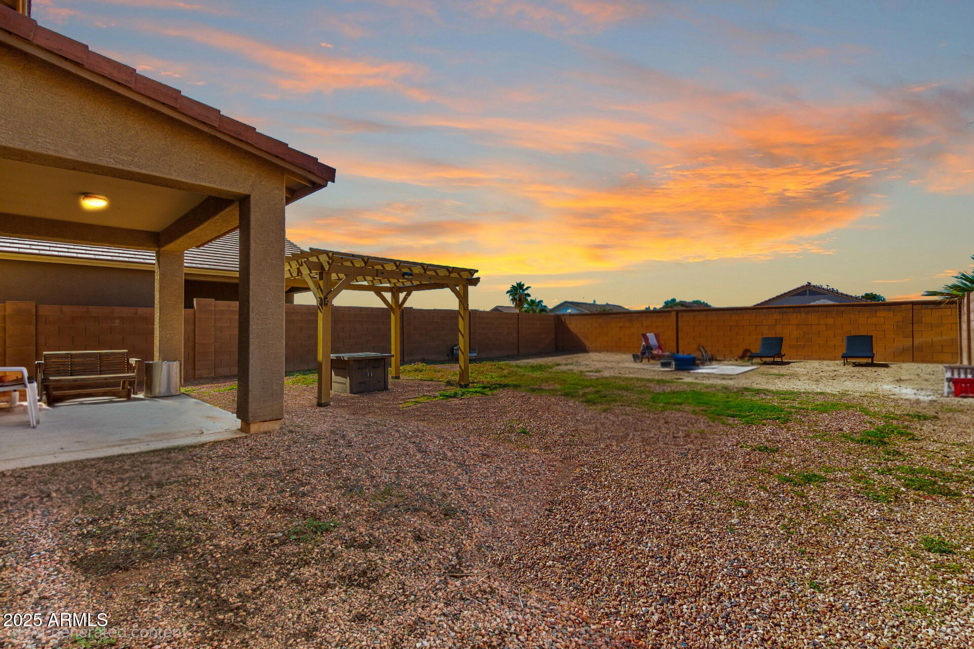 18586 North Lariat Road Maricopa, AZ 85138 - Photo 3 of 16 a view of a house with backyard