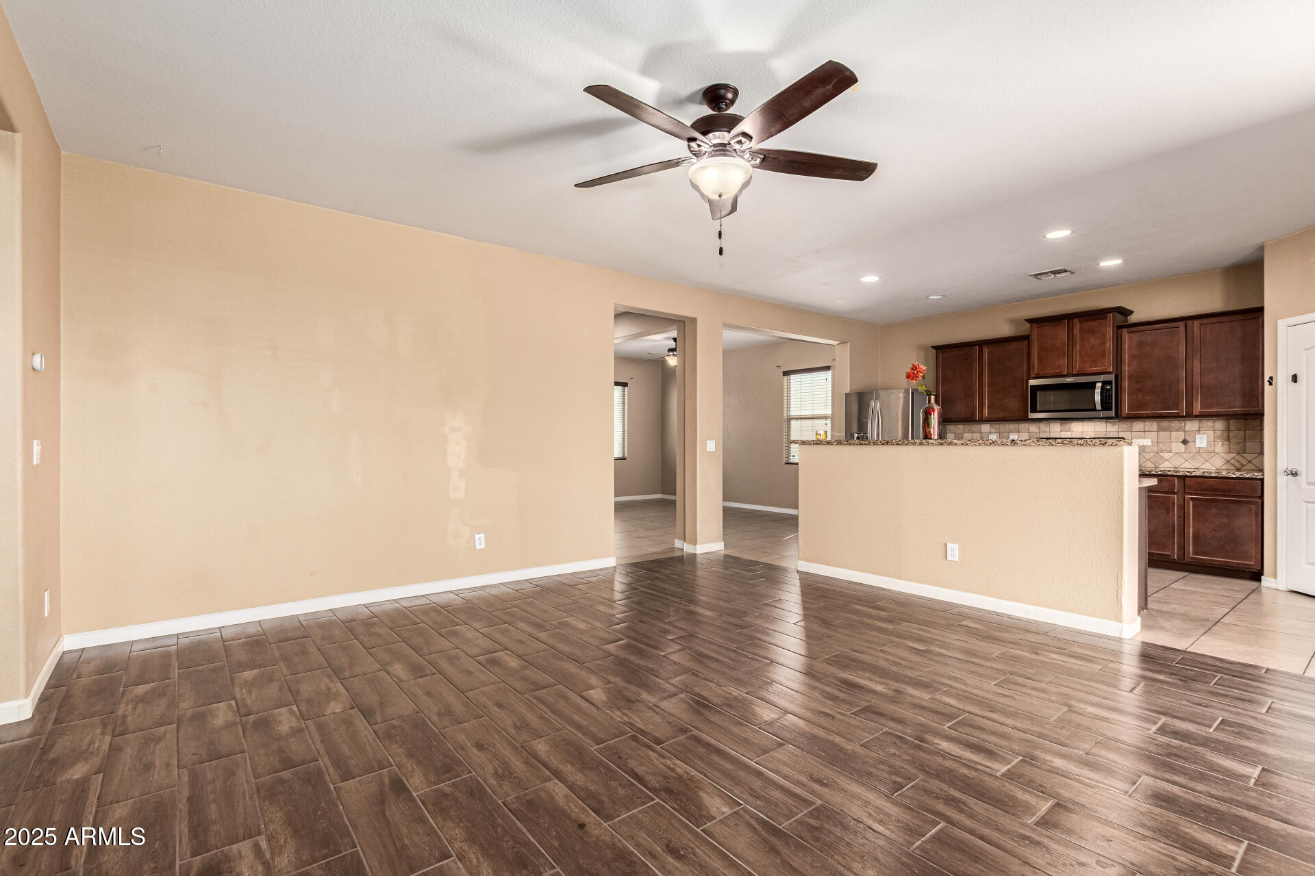 18586 North Lariat Road Maricopa, AZ 85138 - Photo 7 of 16 a view of a kitchen with a sink and a refrigerator