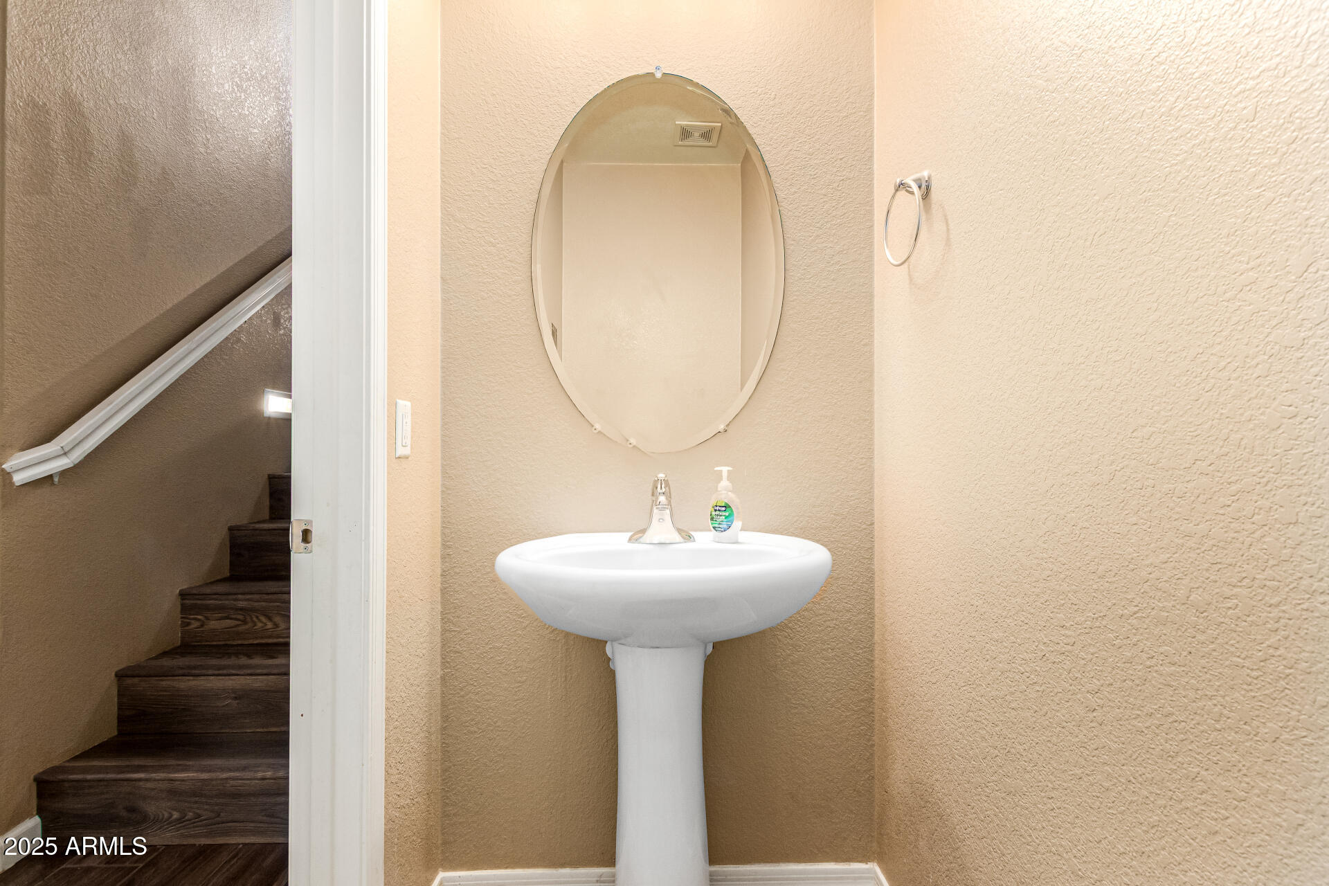 18586 North Lariat Road Maricopa, AZ 85138 - Photo 9 of 16 a bathroom with a sink a mirror and vanity