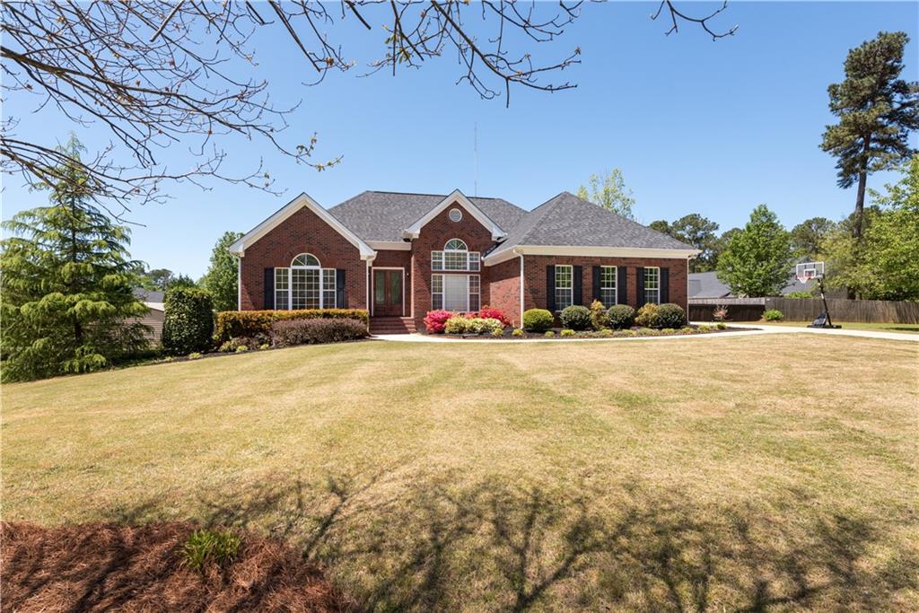 2690 Ho Hum Hollow Road Monroe, GA 30655 - Photo 1 of 1 a front view of a house with a yard