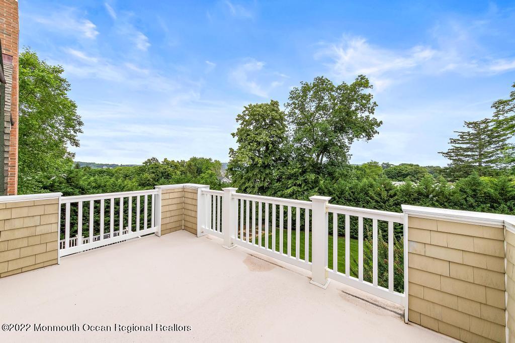 3 Sugar Maple Lane Rumson, NJ 07760 - Photo 29 of 53 a view of a roof deck with wooden fence and floor