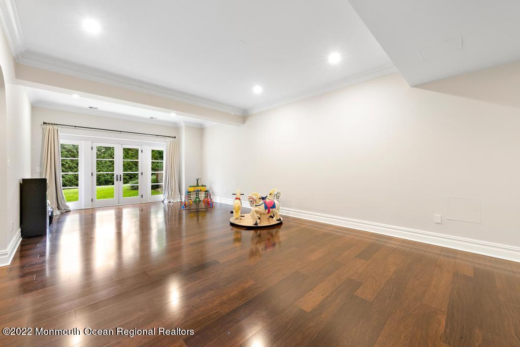 3 Sugar Maple Lane Rumson, NJ 07760 - Photo 39 of 53 a view of empty room with wooden floor and floor to ceiling window
