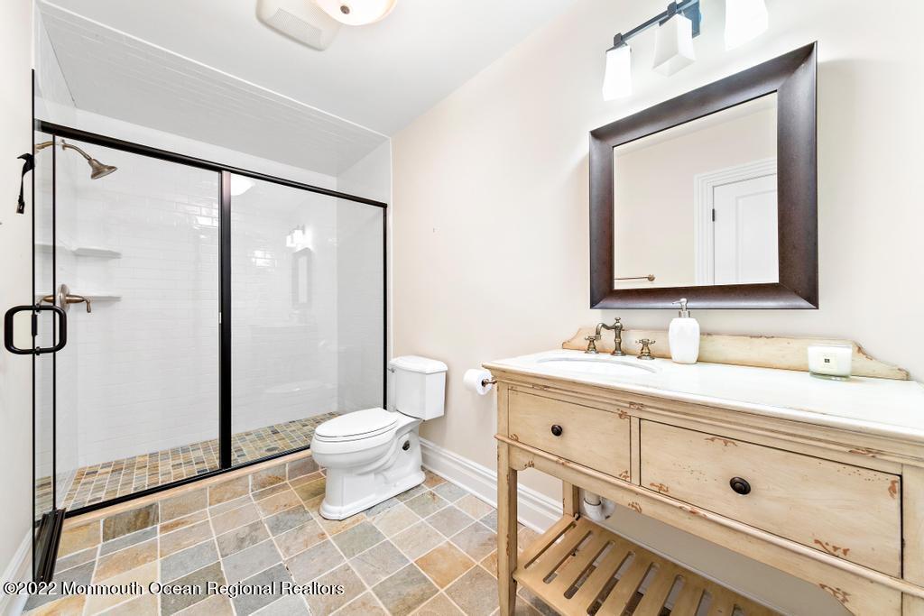3 Sugar Maple Lane Rumson, NJ 07760 - Photo 42 of 53 a bathroom with a toilet sink and a mirror