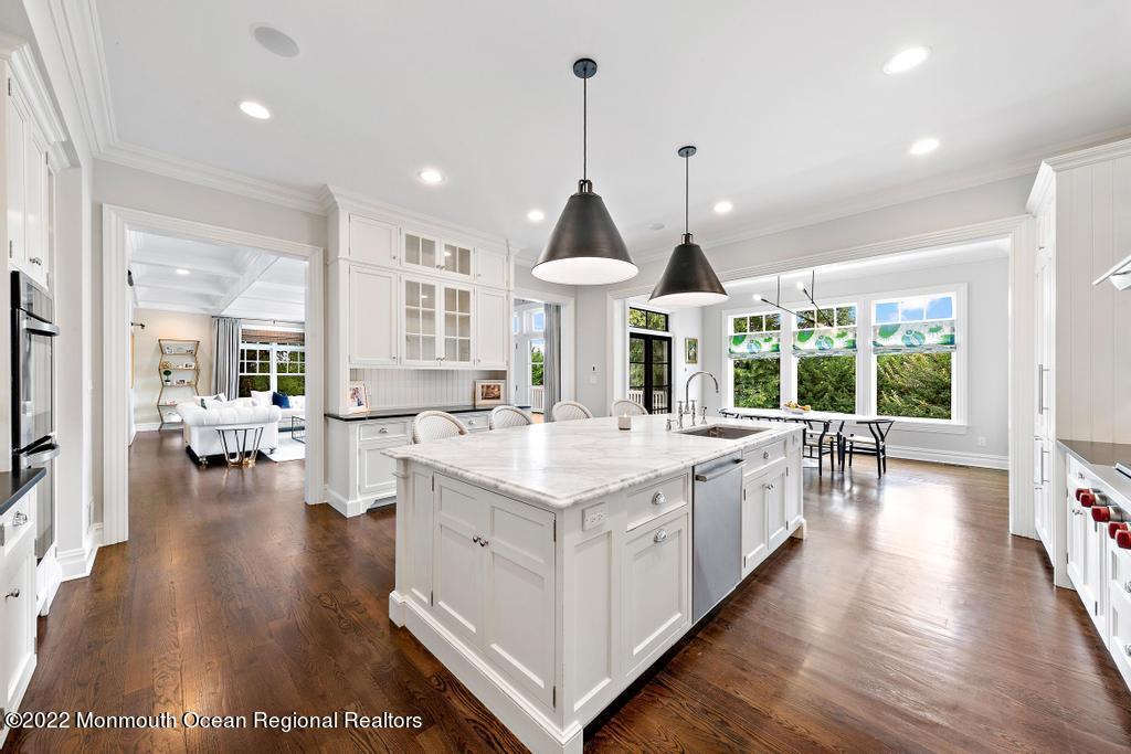 3 Sugar Maple Lane Rumson, NJ 07760 - Photo 9 of 53 a open kitchen with kitchen island a stove a sink a island and windows