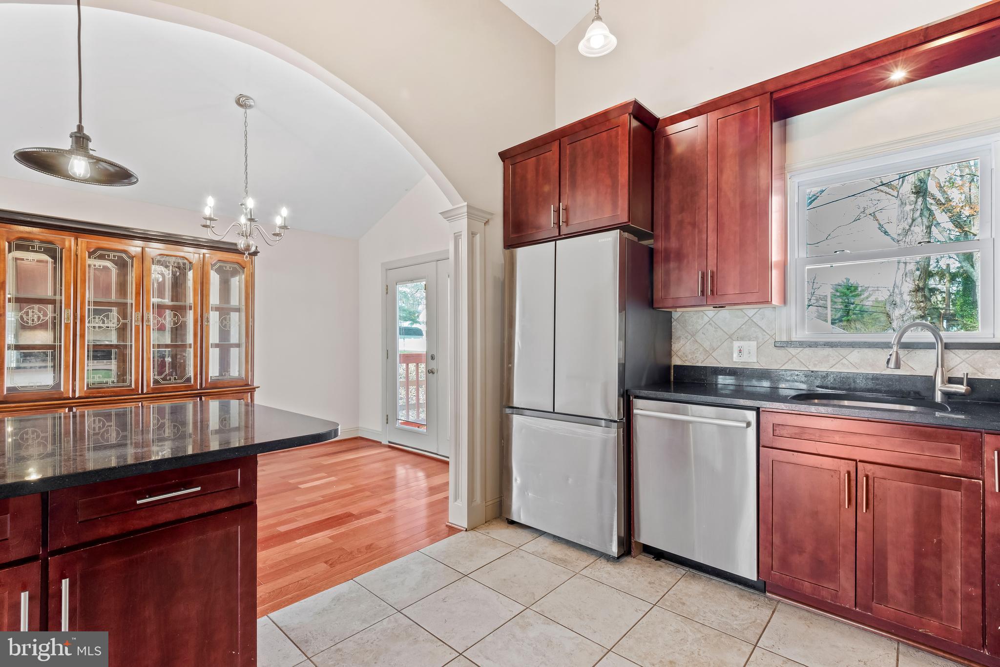 947 Beaverbank Circle Towson, MD 21286 - Photo 13 of 63 a kitchen with granite countertop a refrigerator and a sink