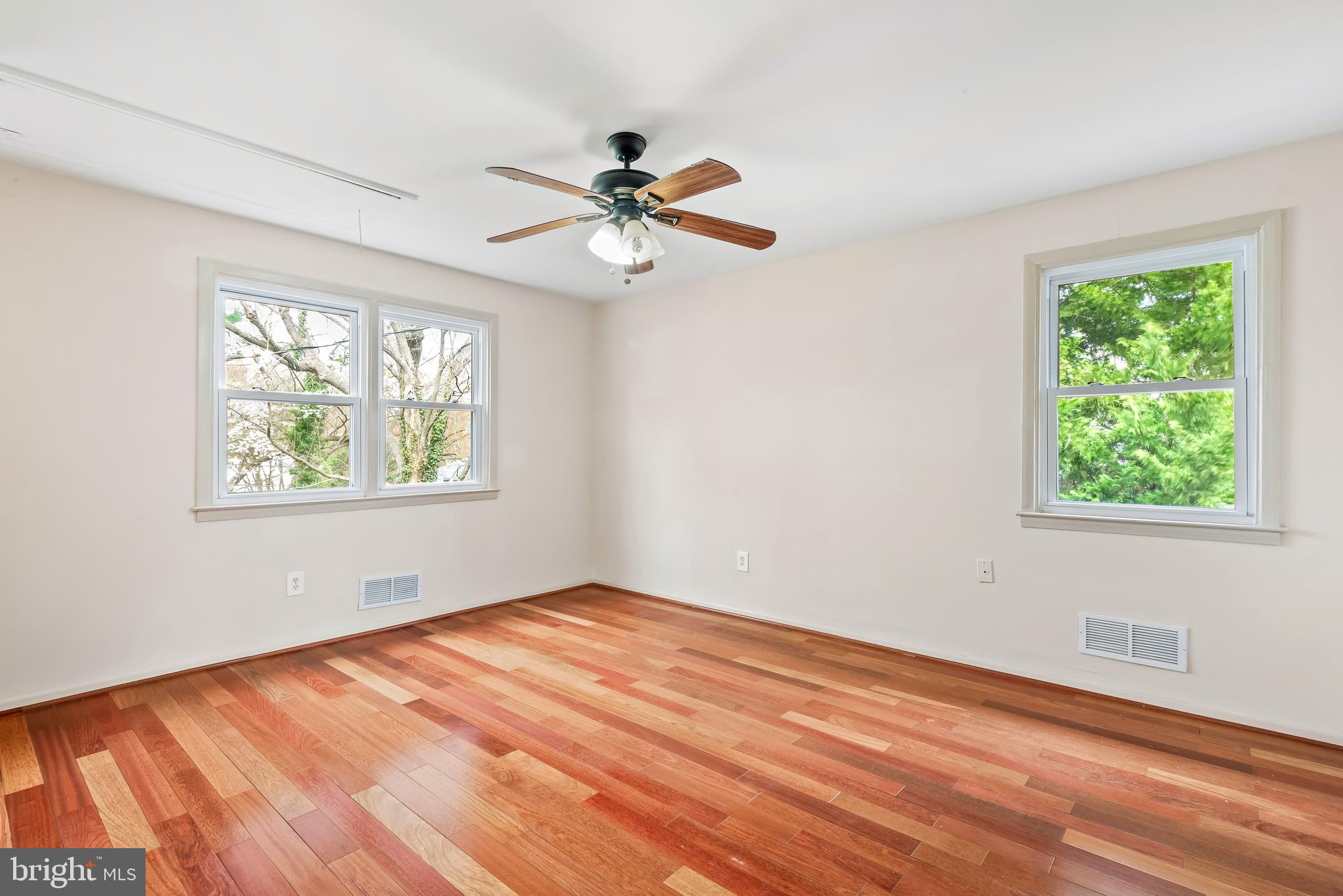 947 Beaverbank Circle Towson, MD 21286 - Photo 19 of 63 a view of empty room with wooden floor and fan