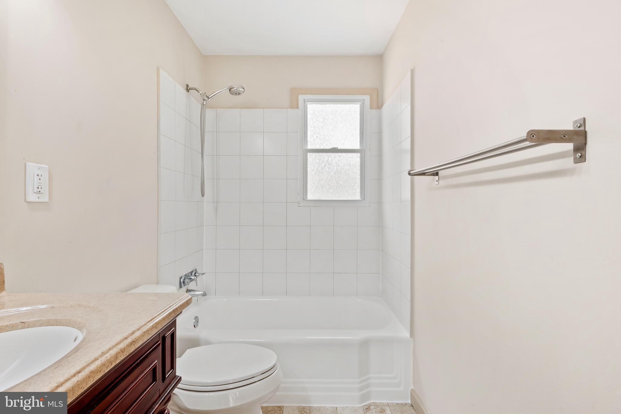 947 Beaverbank Circle Towson, MD 21286 - Photo 24 of 63 a bathroom with a granite countertop bathtub shower sink vanity and toilet