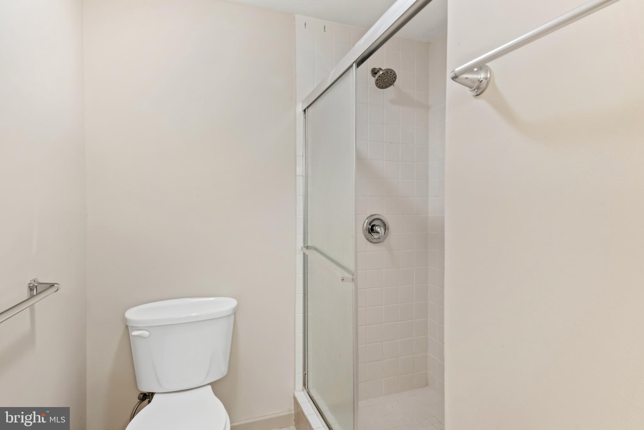 947 Beaverbank Circle Towson, MD 21286 - Photo 35 of 63 a white toilet sitting next to a shower