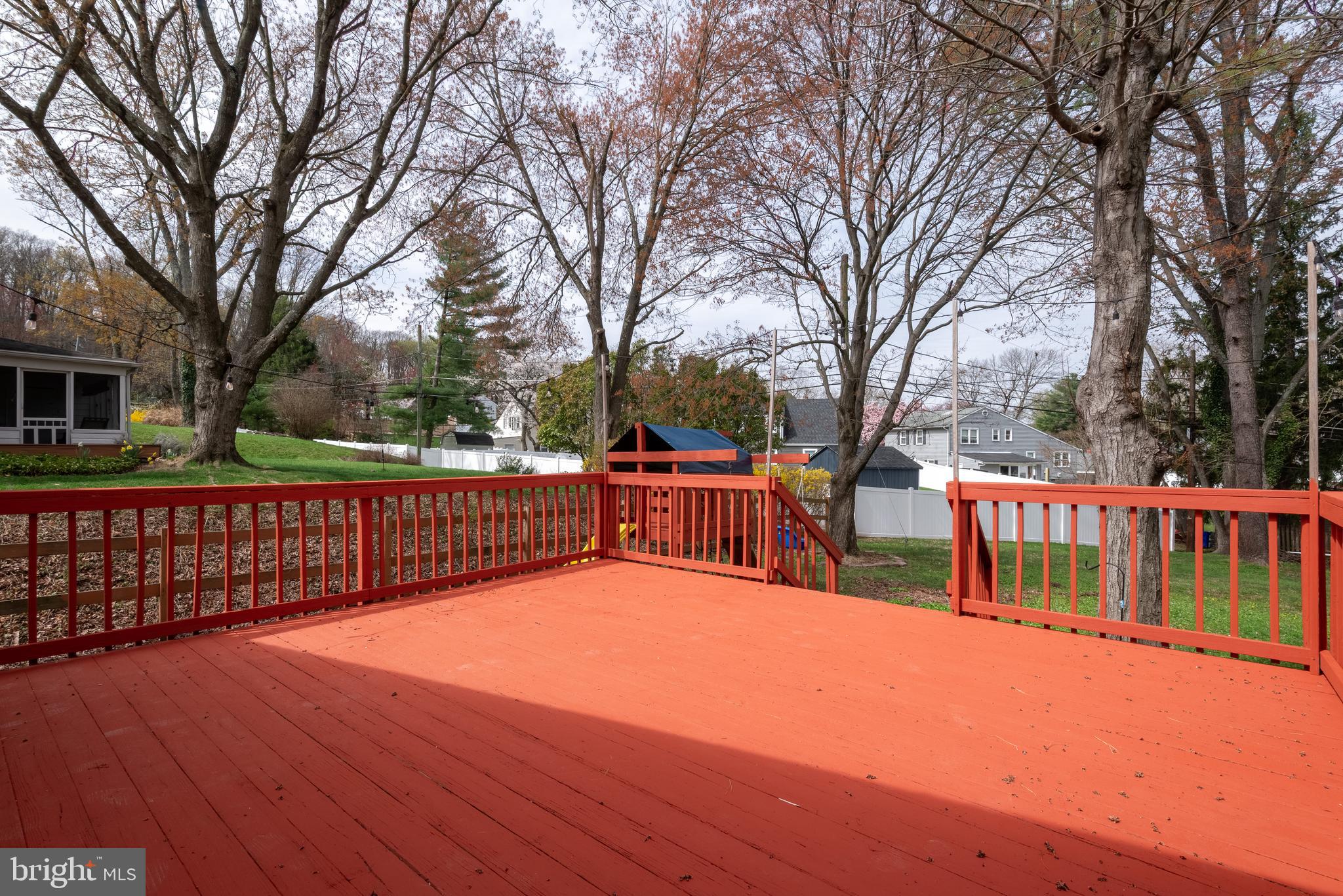 947 Beaverbank Circle Towson, MD 21286 - Photo 49 of 63 a view of a house with large wooden deck and a backyard