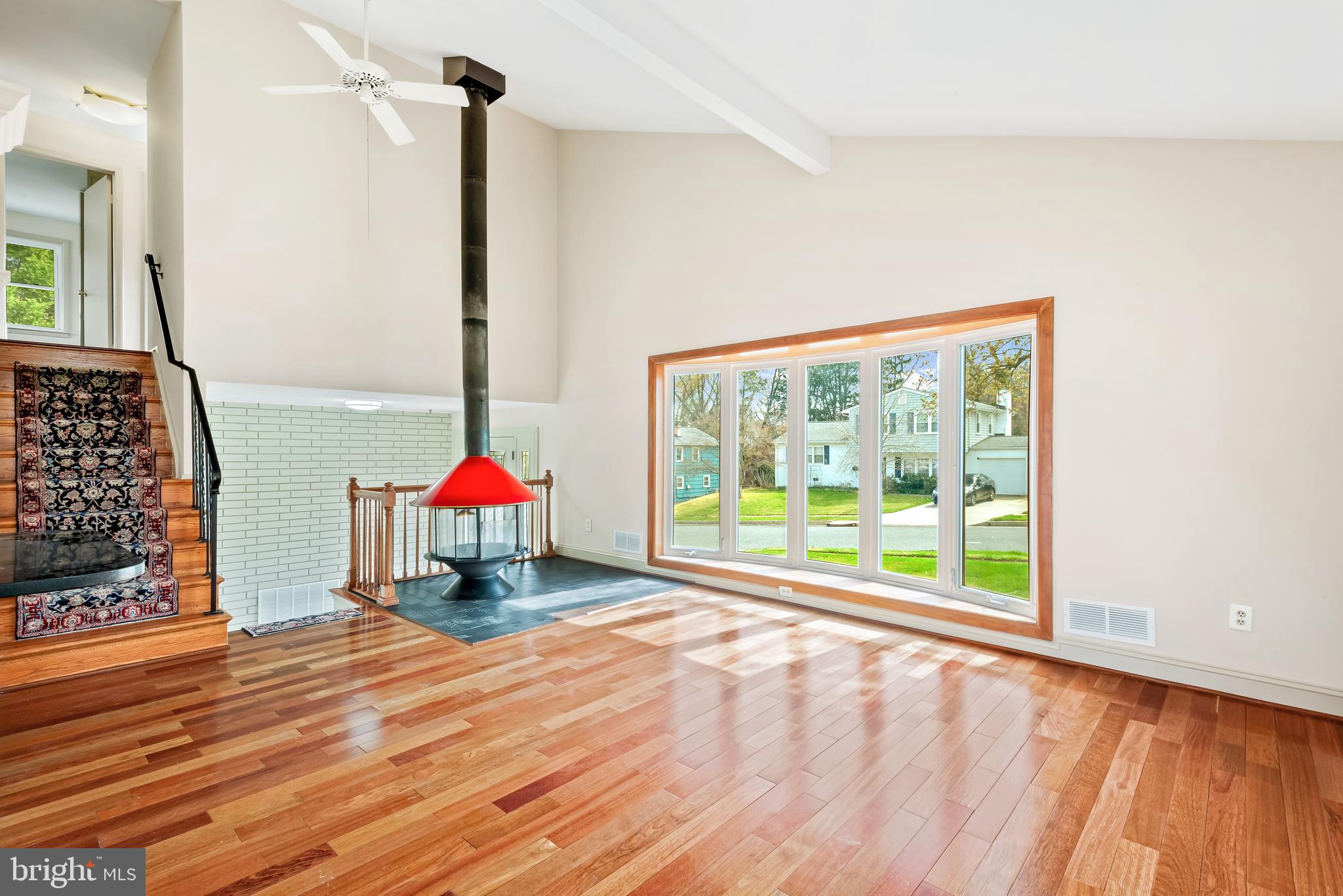 947 Beaverbank Circle Towson, MD 21286 - Photo 5 of 63 a view of an empty room with wooden floor and windows