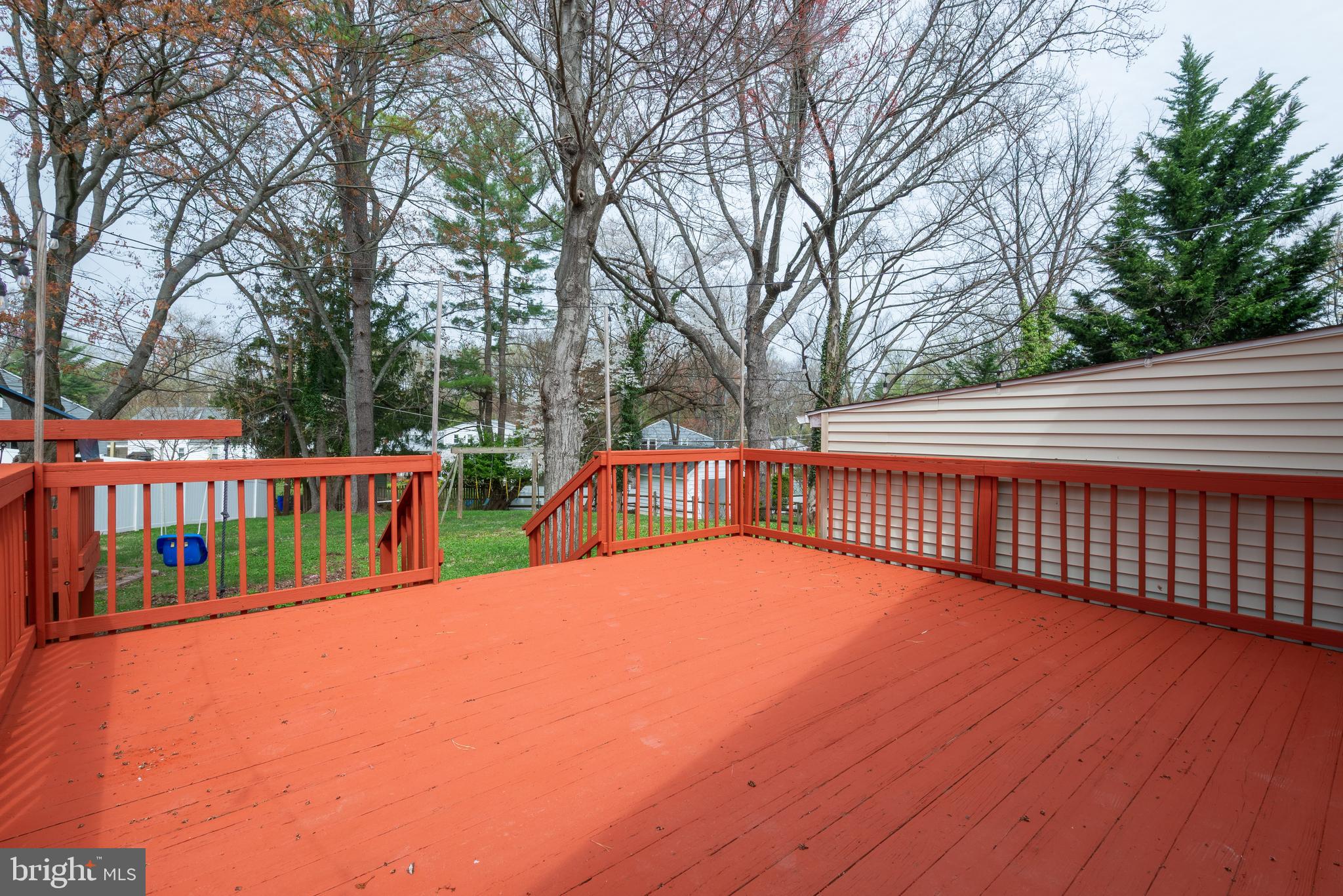 947 Beaverbank Circle Towson, MD 21286 - Photo 51 of 63 a view of a deck with large trees and wooden fence