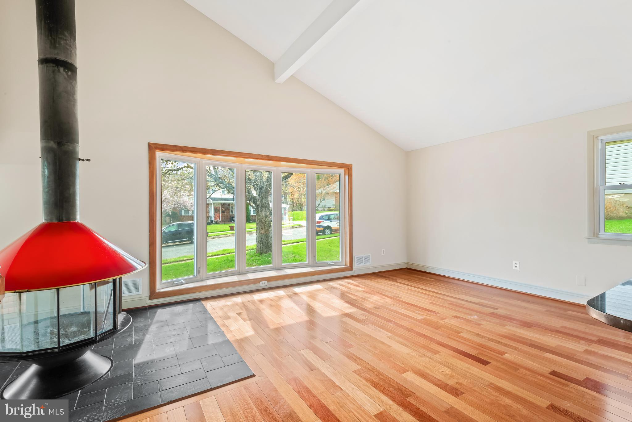 947 Beaverbank Circle Towson, MD 21286 - Photo 6 of 63 a view of an empty room with window and wooden floor