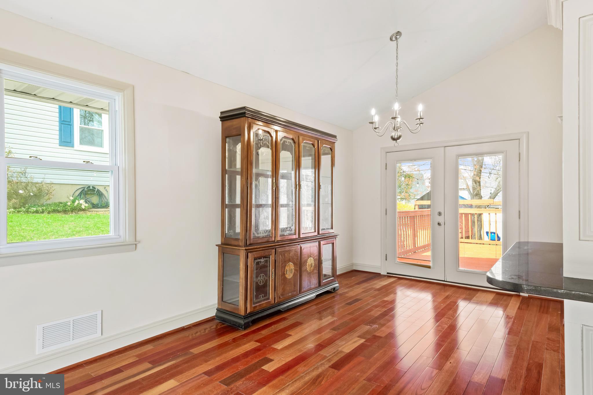 947 Beaverbank Circle Towson, MD 21286 - Photo 8 of 63 a view of an empty room with wooden floor and a window