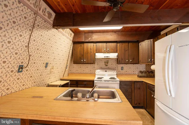 a view of porch with wooden floor in outdoor space