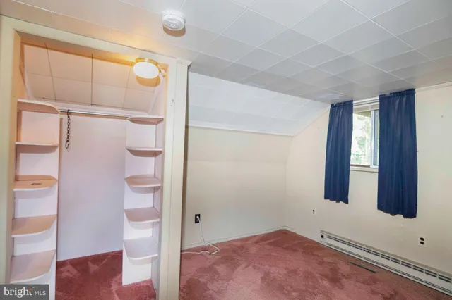 a view of a lake with houses in the back