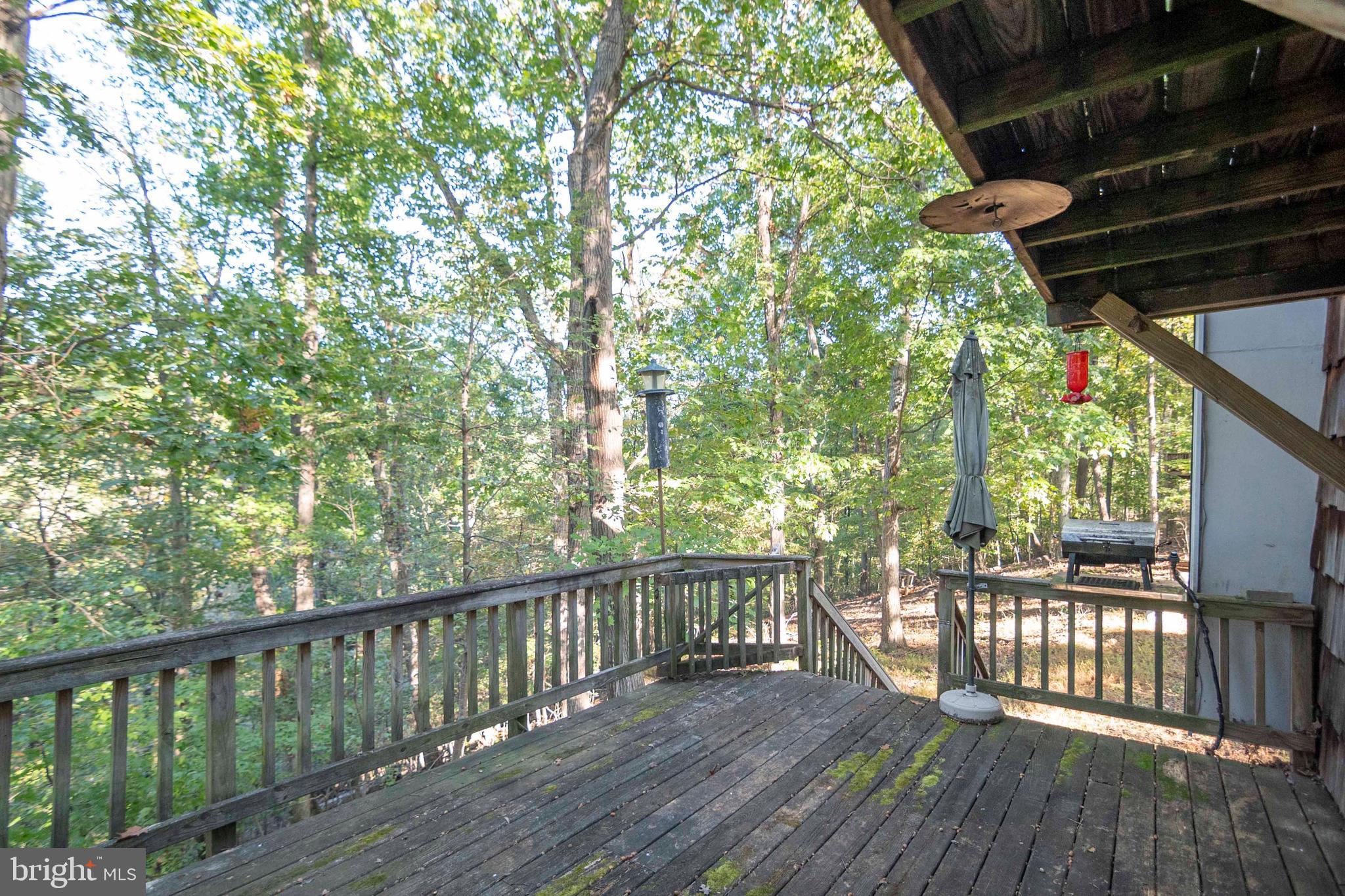 458 Hobbs Knob Road Front Royal, VA 22630 - Photo 44 of 94 a view of roof deck with wooden floor and fence