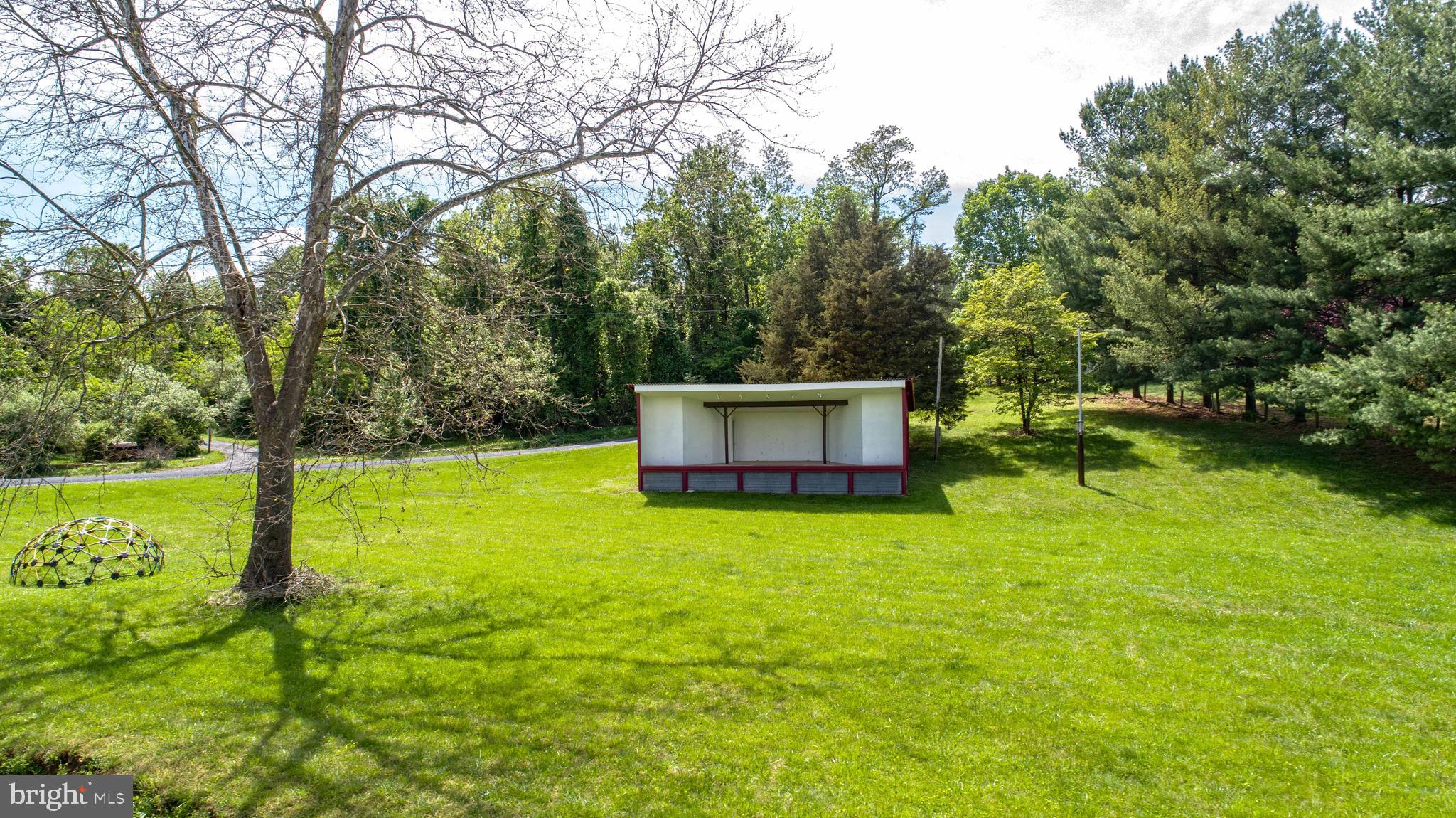 458 Hobbs Knob Road Front Royal, VA 22630 - Photo 88 of 94 a backyard of a house with yard and trampoline