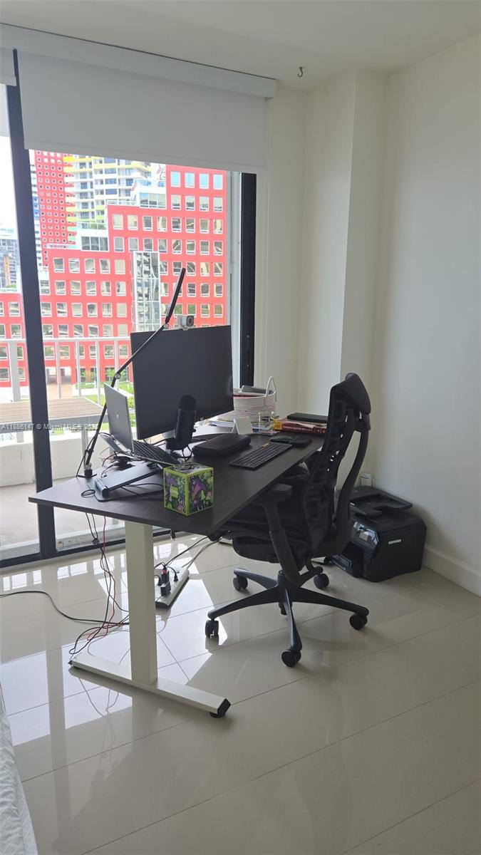 200 Southeast 15th Road, Unit 8J Miami, FL 33129 - Photo 13 of 20 a view of workspace with gym equipment