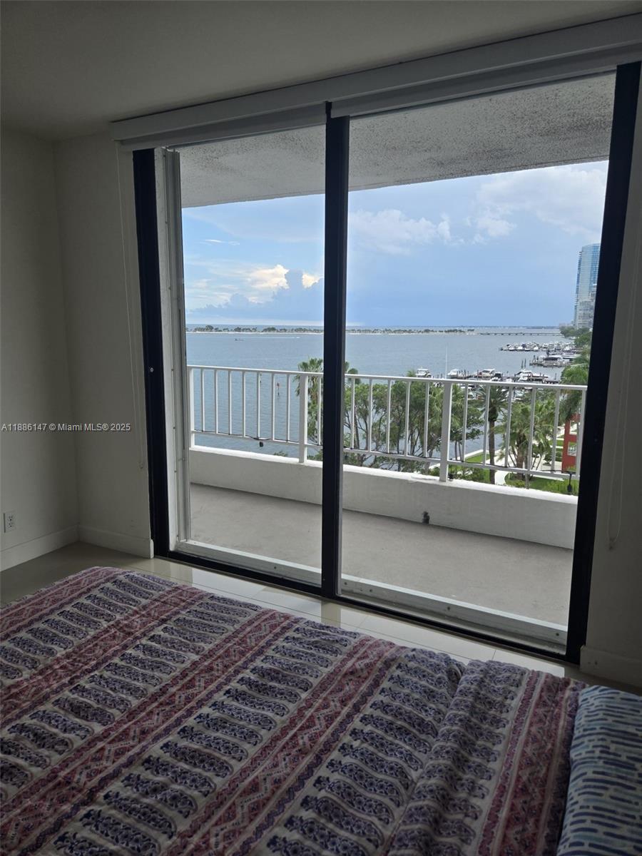 200 Southeast 15th Road, Unit 8J Miami, FL 33129 - Photo 17 of 20 a view of an empty room with a floor to ceiling window