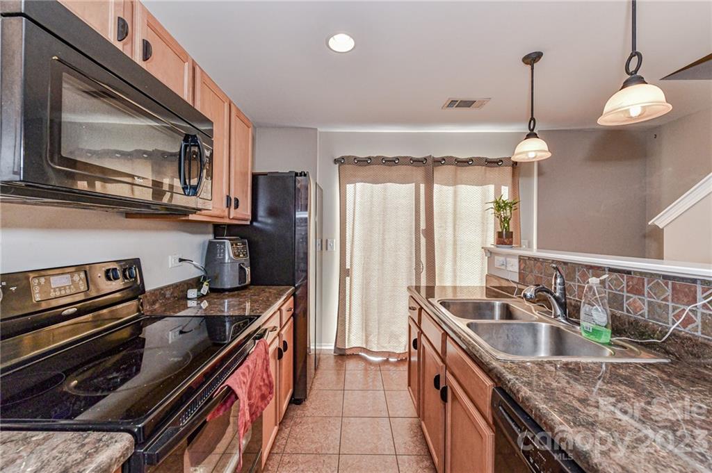 319 River Clay Road Fort Mill, SC 29708 - Photo 12 of 27 a kitchen that has a sink a stove and a microwave