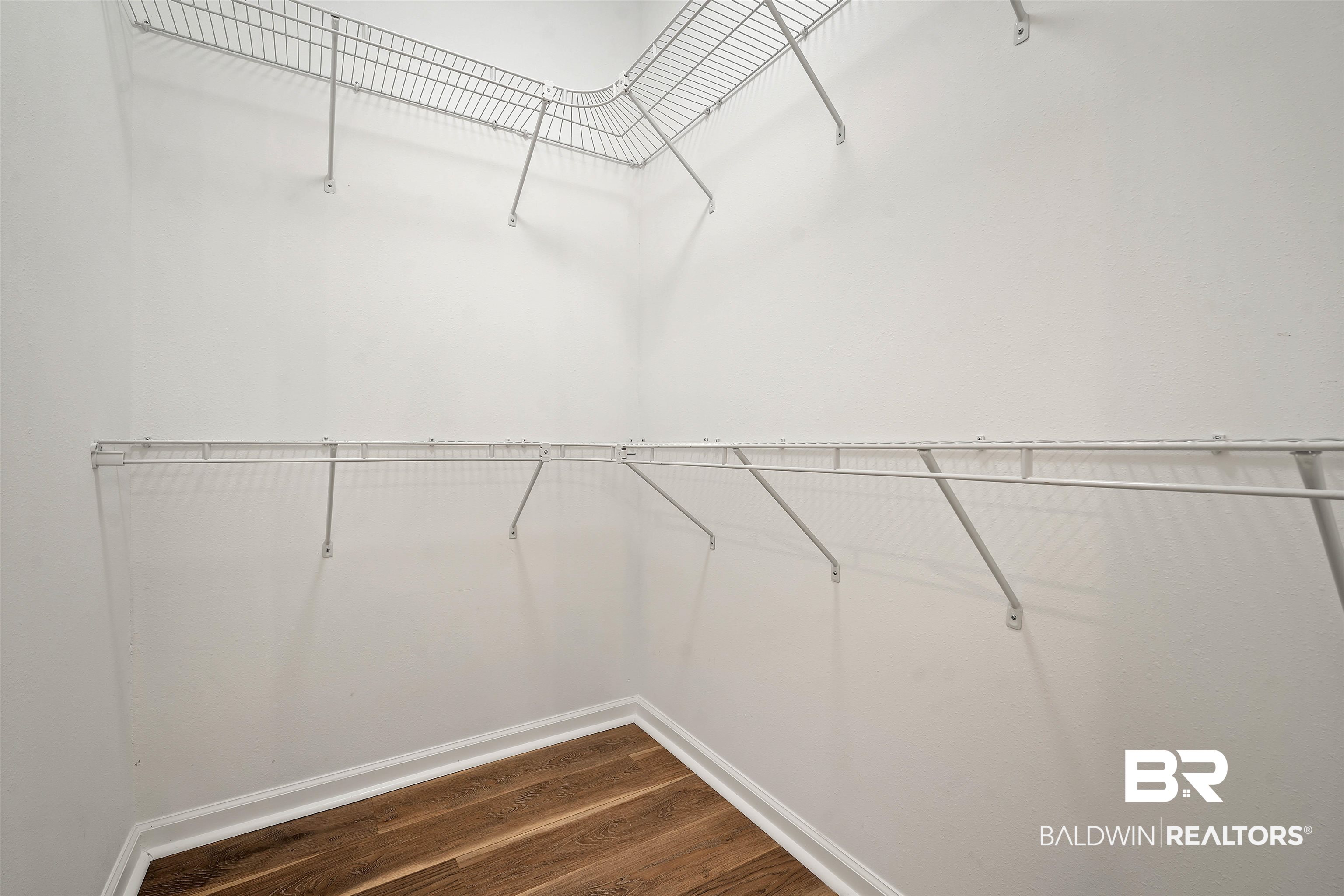 250 North Spring Lake Drive Mobile, AL 36695 - Photo 15 of 29 Walk in closet with dark wood-style floors