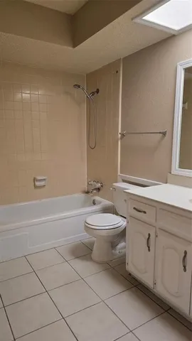 a bathroom with a toilet a sink and bathtub