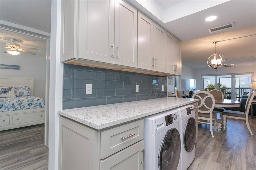 633 Alhambra Road, Unit 305 Venice, FL 34285 - Photo 18 of 43 a kitchen with a stove oven and cabinets