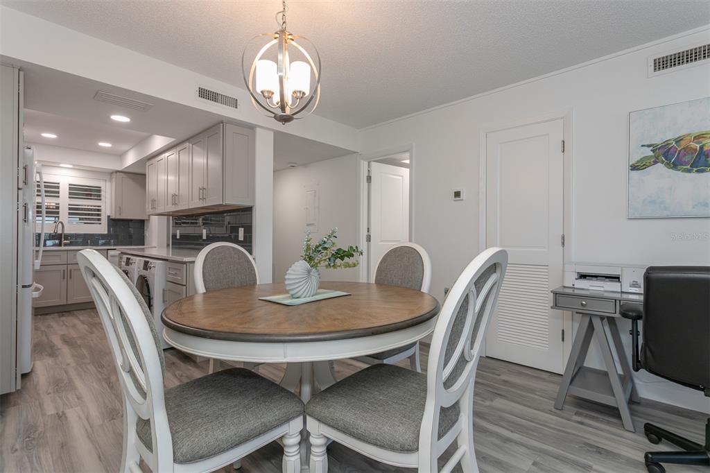 633 Alhambra Road, Unit 305 Venice, FL 34285 - Photo 22 of 43 a view of a dining room with furniture
