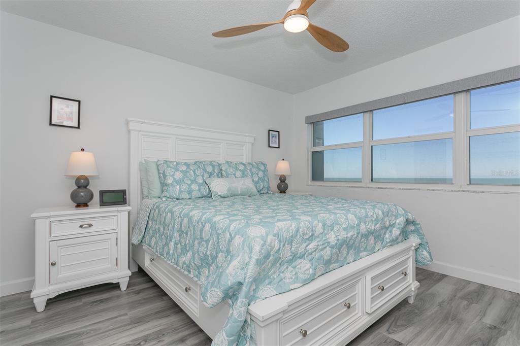 633 Alhambra Road, Unit 305 Venice, FL 34285 - Photo 30 of 43 a bedroom with a bed and a dresser