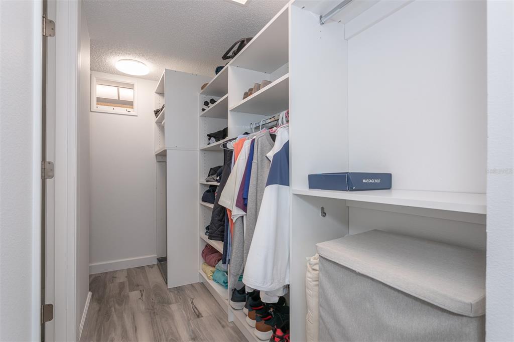 633 Alhambra Road, Unit 305 Venice, FL 34285 - Photo 33 of 43 a view of walk in closet with clothes and shoes