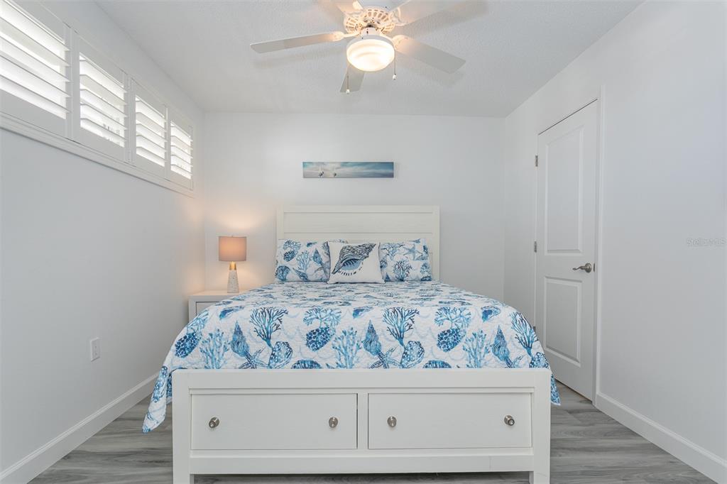 633 Alhambra Road, Unit 305 Venice, FL 34285 - Photo 35 of 43 a bedroom with a bed and a window