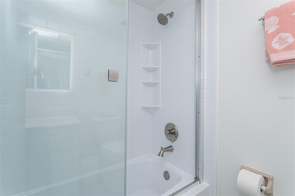 633 Alhambra Road, Unit 305 Venice, FL 34285 - Photo 41 of 43 a bathroom with a shower and a bathtub