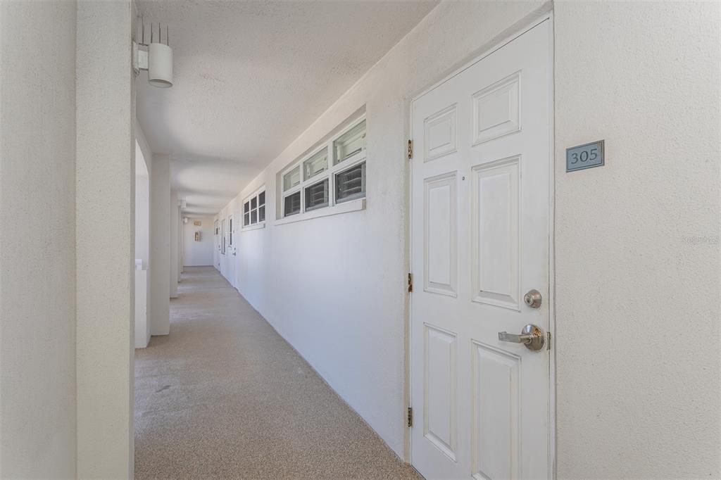 633 Alhambra Road, Unit 305 Venice, FL 34285 - Photo 43 of 43 a view of a hallway with hallway