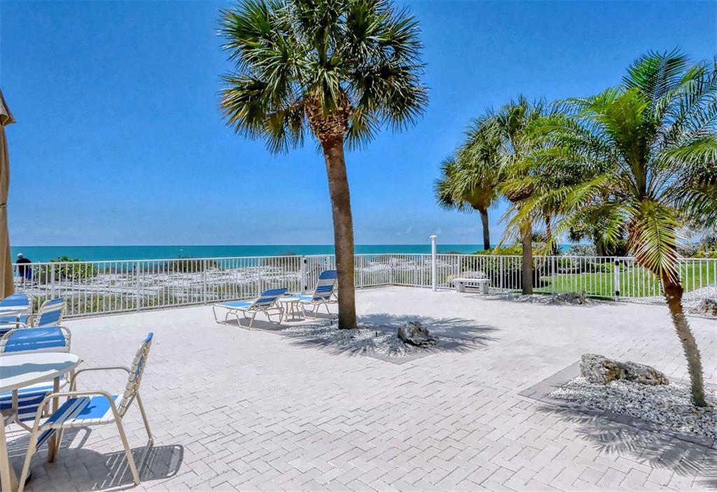 633 Alhambra Road, Unit 305 Venice, FL 34285 - Photo 8 of 43 a view of a ocean with a table and chairs